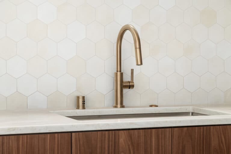 8542 Interlake Ave N kitchen sink with brass faucet and hexagon tile, new construction by Seattle Modern Buildings near Green Lake, Seattle