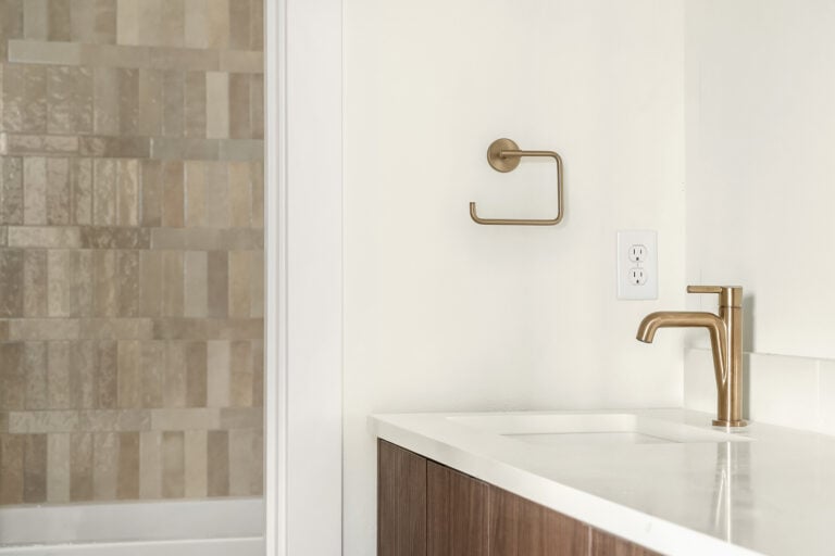 8544 Interlake Ave N bath vanity with brass fixtures, new construction by Seattle Modern Buildings near Green Lake, Seattle