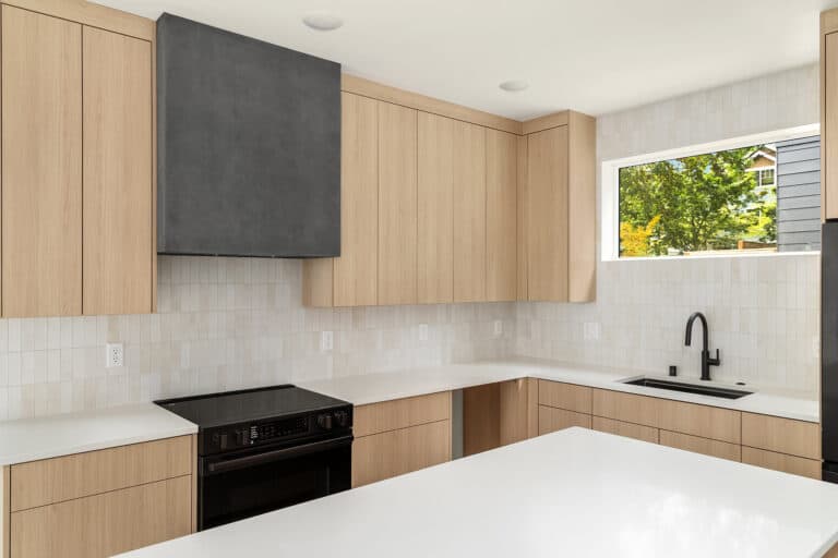 8544 Interlake Ave N kitchen with island and tile backsplash, new construction by Seattle Modern Buildings near Green Lake, Seattle